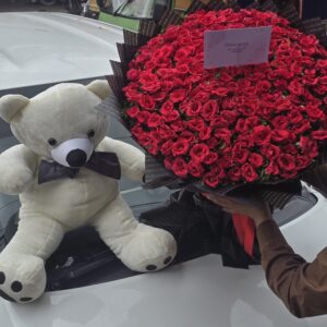 Red roses bouquet and teddy